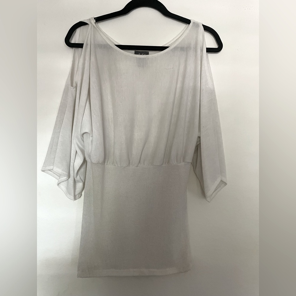 White top with open keyhole sleeves.